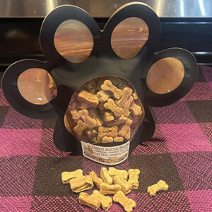 Peanut butter and bananas dog treats in new Bad Dog Bakery packages that are shaped like a paw print.