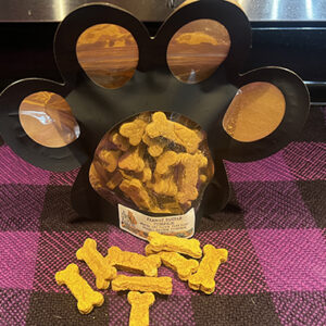 Peanut butter and pumpkin dog treats in new Bad Dog Bakery packages that are shaped like a paw print.